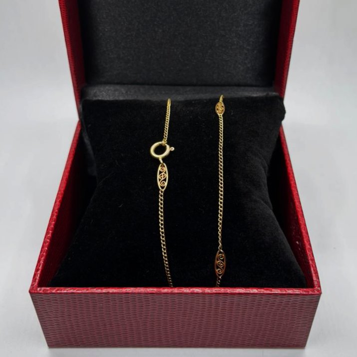 CADENA EN ORO 18K CON ESTACIONES