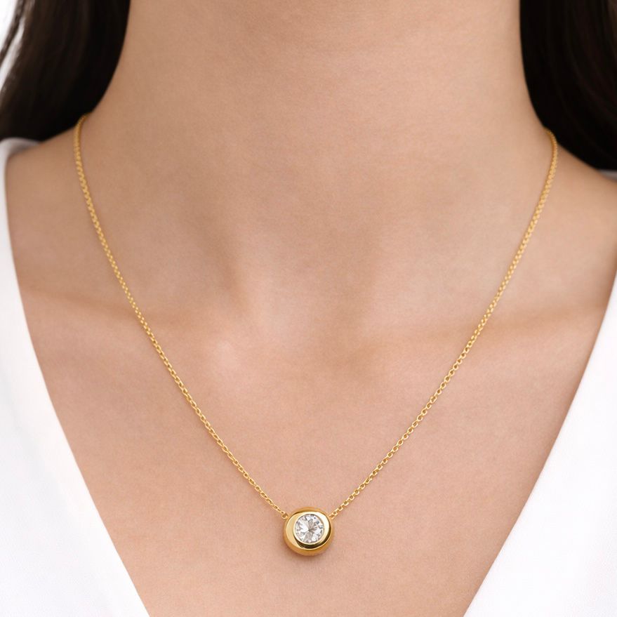 CONJUNTO DE ORO 18 KILATES CON DIJE SUSANITA Y CIRCÓN