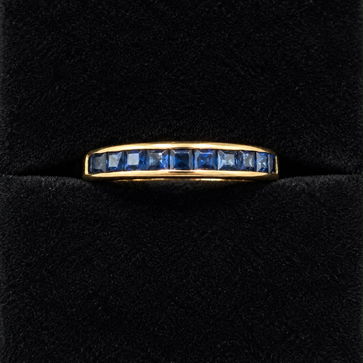 ANILLO MEDIO SIN FIN CON ZAFIROS EN ORO 18K