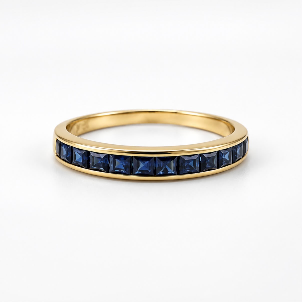 ANILLO MEDIO SIN FIN CON ZAFIROS EN ORO 18K
