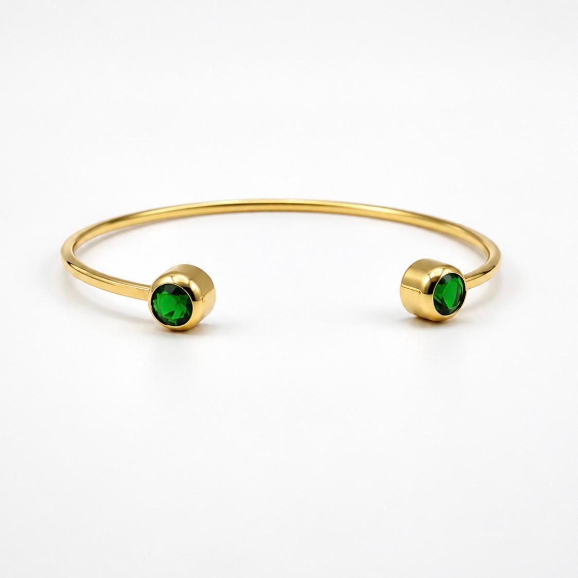PULSERA RÍGIDA ABIERTA EN ORO 18K CON PIEDRAS VERDES
