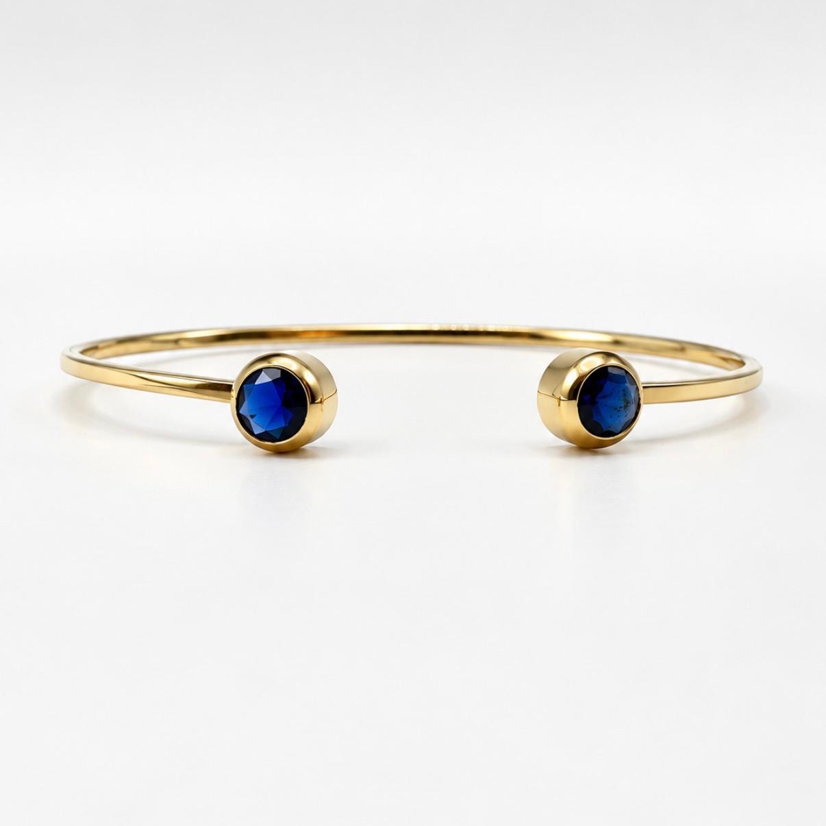 PULSERA RÍGIDA ABIERTA EN ORO 18K CON PIEDRAS AZULES