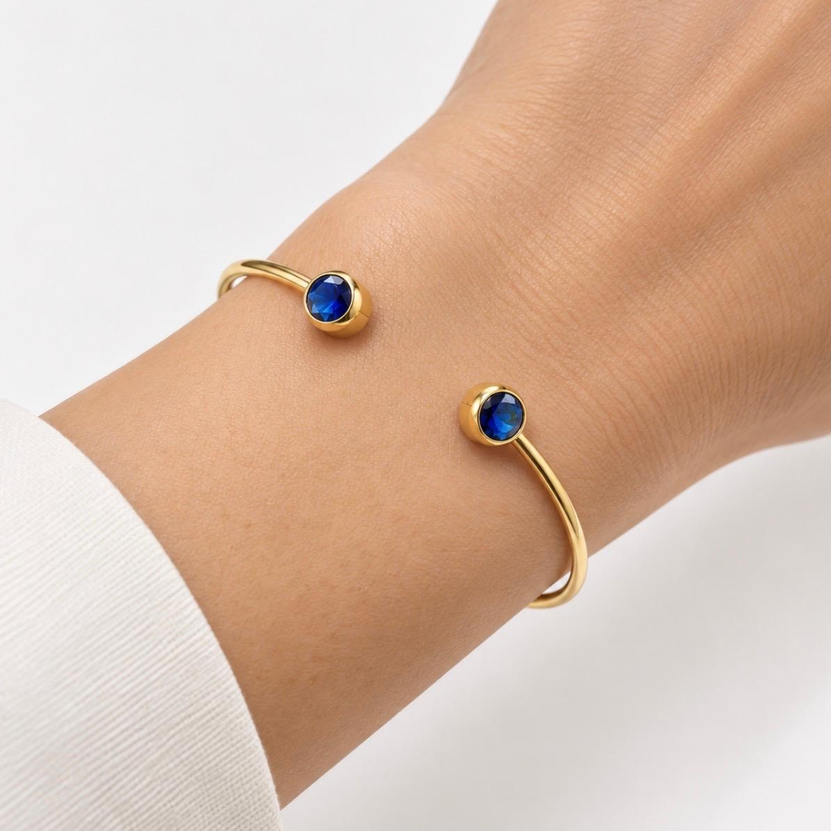 PULSERA RÍGIDA ABIERTA EN ORO 18K CON PIEDRAS AZULES
