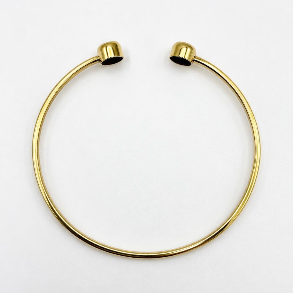 PULSERA RÍGIDA ABIERTA EN ORO 18K CON PIEDRAS AZULES